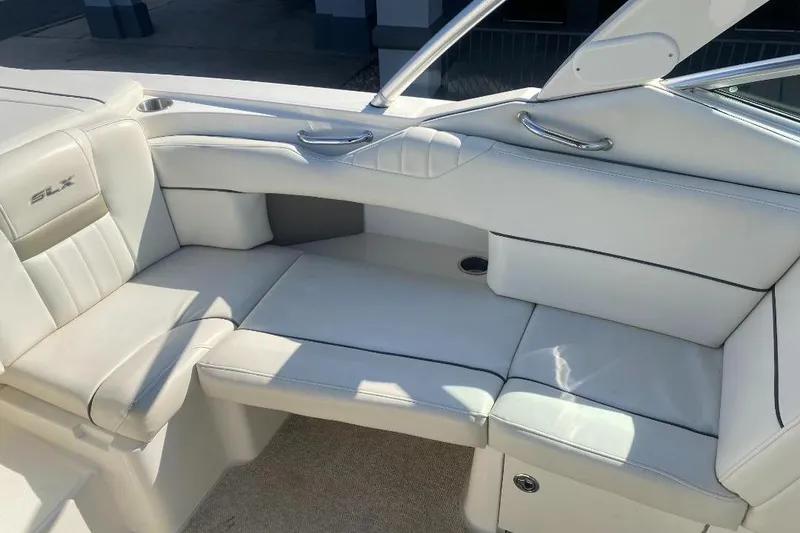 Slide: The Image of 2006 Sea Ray 270 SLX boat interior with white leather seating and sleek design. - 7