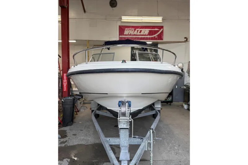Slide: The Image of 2003 Boston Whaler 180 Ventura boat on trailer in garage setting. - 3
