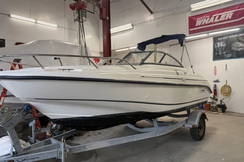 Slide: The Image of 2003 Boston Whaler 180 Ventura boat on trailer in indoor storage facility. - 8