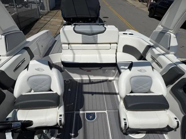 Slide: The Image of 2023 Chaparral 267 SSX boat interior with luxurious seating and modern design. - 13