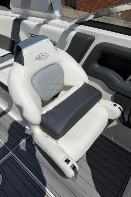 Slide: The Image of 2023 Chaparral 267 SSX boat seat, white and gray leather, modern design. - 15