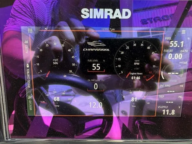 Slide: The Image of Dashboard of a 2023 Chaparral 267 SSX boat with Simrad display. - 23