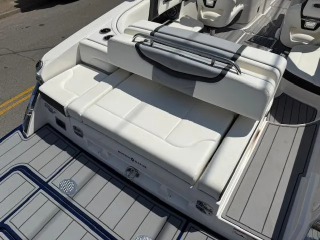 Slide: The Image of 2023 Chaparral 267 SSX boat interior with white seating and sleek design. - 28