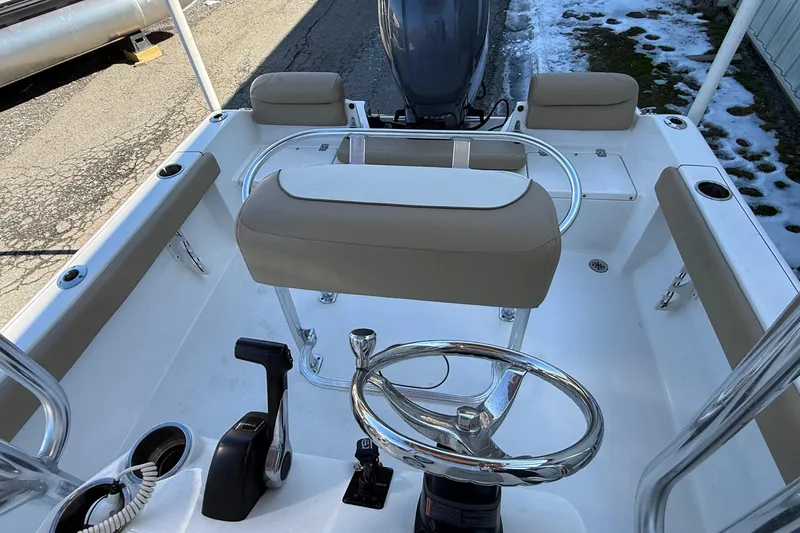 Slide: The Image of 2017 Key West 189 FS boat interior with steering wheel and seating. - 16