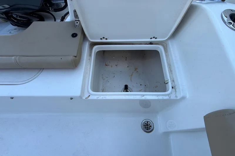Slide: The Image of Open storage compartment on a 2017 Key West 189 FS boat deck. - 18