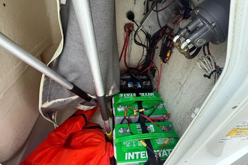 Slide: The Image of Interior of a 2017 Key West 189 FS boat showing batteries and wiring setup. - 23