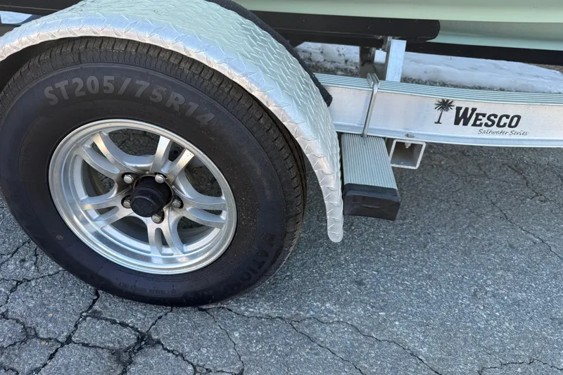 Slide: The Image of Trailer tire and fender of 2017 Key West 189 FS boat on Wesco Saltwater Series trailer. - 28