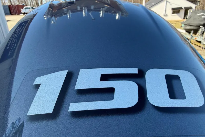 Slide: The Image of Close-up of 2017 Key West 189 FS boat with '150' decal on blue surface. - 36