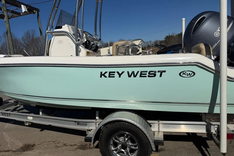 Slide: The Image of 2017 Key West 189 FS boat on trailer, side view, clear sky background. - 38
