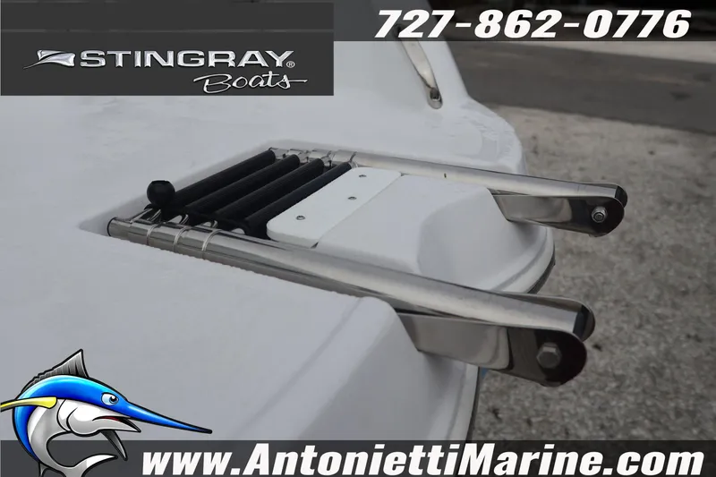 Slide: The Image of Stingray 236 CC 2026 boat ladder detail with contact information and logo. - 10