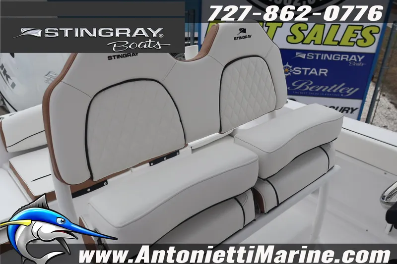 Slide: The Image of 2026 Stingray 236 CC boat seating with logo and contact details. - 15