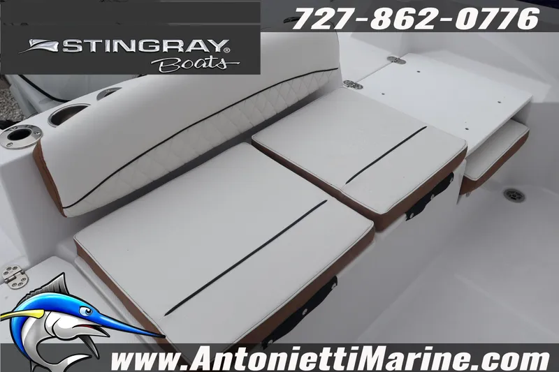 Slide: The Image of 2026 Stingray 236 CC boat seating, white cushions, Antonietti Marine contact details. - 16