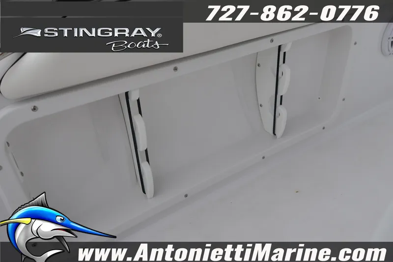 Slide: The Image of 2026 Stingray 236 CC boat interior with storage compartments, Antonietti Marine branding. - 22