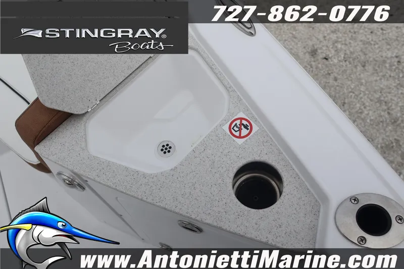 Slide: The Image of 2026 Stingray 236 CC boat detail with sink and logo, Antonietti Marine contact info. - 25