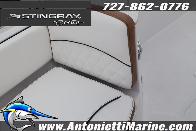 Slide: The Image of 2026 Stingray 236 CC boat interior with quilted seating, Antonietti Marine branding. - 29