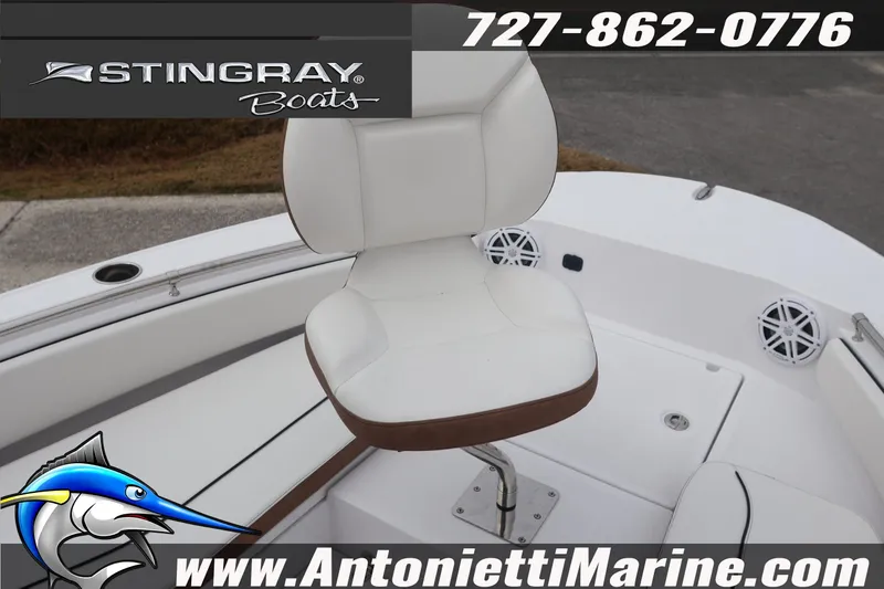 Slide: The Image of 2026 Stingray 236 CC boat interior with white seating, displayed by Antonietti Marine. - 30