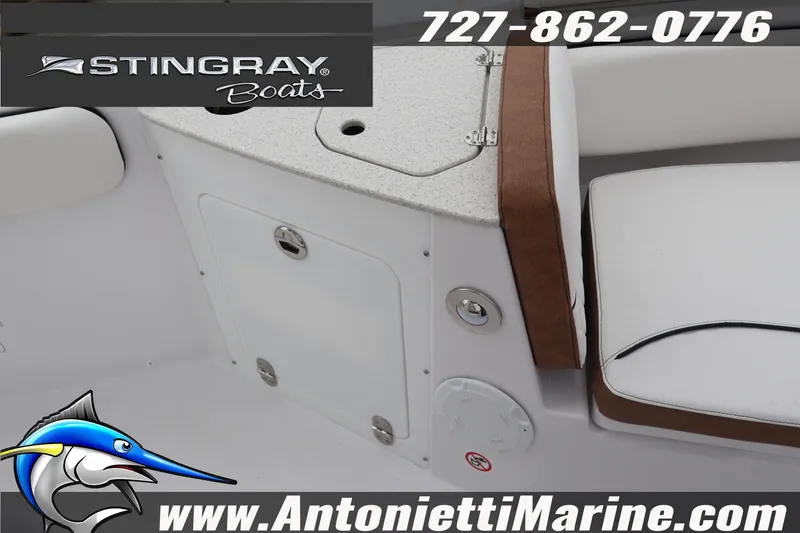 Slide: The Image of 2026 Stingray 236 CC boat interior with seating and storage, featuring Antonietti Marine branding. - 35