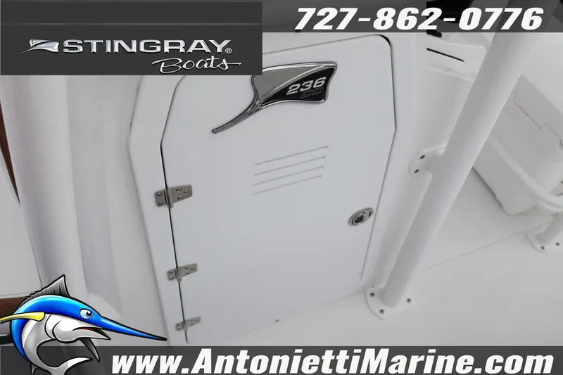Slide: The Image of 2026 Stingray 236 CC boat interior with logo and contact details. - 36