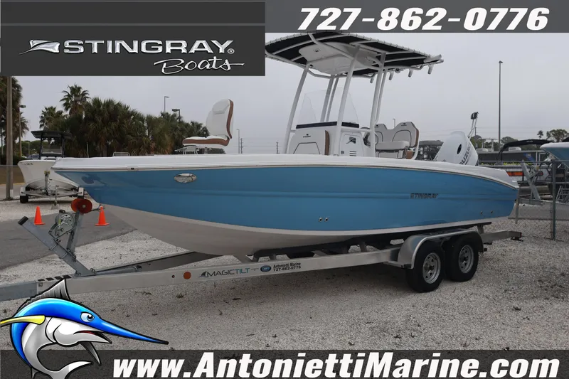 Slide: The Image of 2026 Stingray 236 CC boat on trailer at Antonietti Marine dealership. - 4