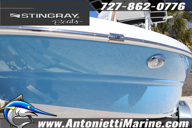 Slide: The Image of 2026 Stingray 236 CC boat with blue hull, displayed at Antonietti Marine. - 42
