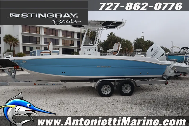 Slide: The Image of 2026 Stingray 236 CC boat on trailer at Antonietti Marine dealership. - 5
