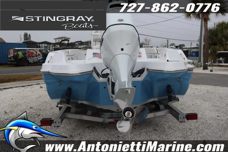 Slide: The Image of 2026 Stingray 236 CC boat on trailer, displayed at Antonietti Marine dealership. - 6