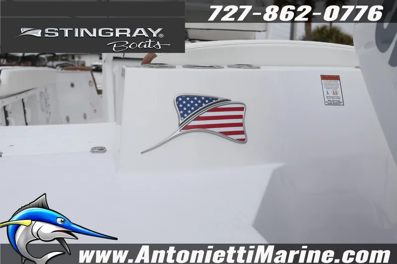 Slide: The Image of 2026 Stingray 236 CC boat with American flag emblem, Antonietti Marine branding. - 7