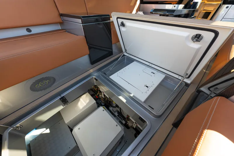 Slide: The Image of 2024 Wajer 55 HT yacht interior with open storage compartment and luxurious seating. - 19