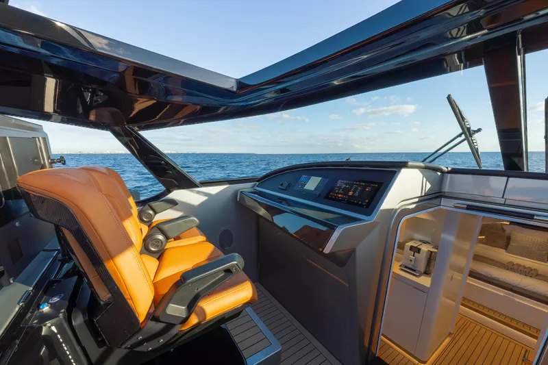 Slide: The Image of 2024 Wajer 55 HT yacht cockpit with luxurious seating and advanced navigation system. - 20