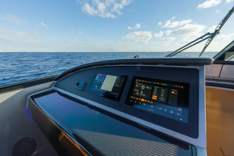Slide: The Image of Dashboard of 2024 Wajer 55 HT yacht with advanced navigation screens, ocean view. - 21