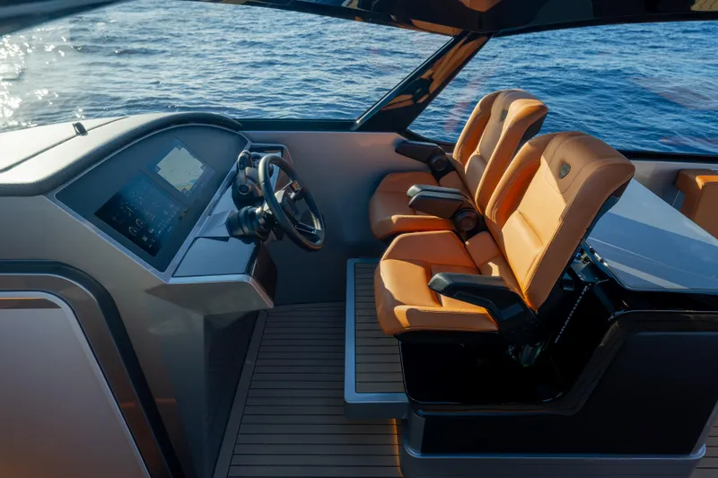 Slide: The Image of 2024 Wajer 55 HT yacht cockpit with luxury seating and advanced navigation system. - 24