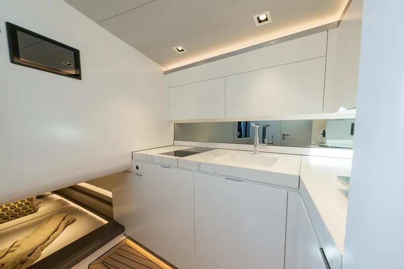 Slide: The Image of Luxurious interior of 2024 Wajer 55 HT yacht with modern white cabinetry and sleek design. - 28