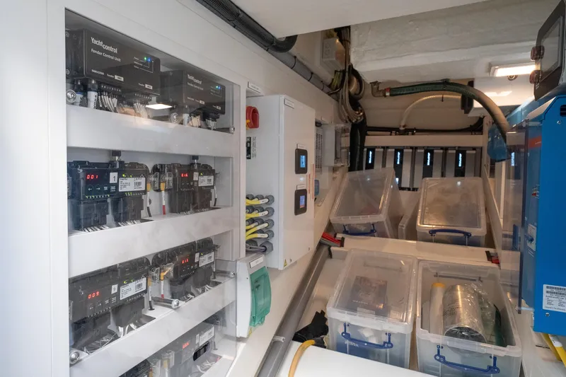 Slide: The Image of Electrical control room of 2024 Wajer 55 HT yacht, featuring organized wiring and storage boxes. - 42