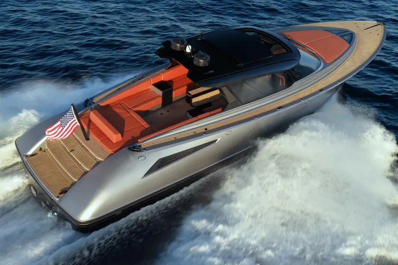 Slide: The Image of 2024 Wajer 55 HT luxury yacht cruising on open water, featuring sleek design and American flag. - 45