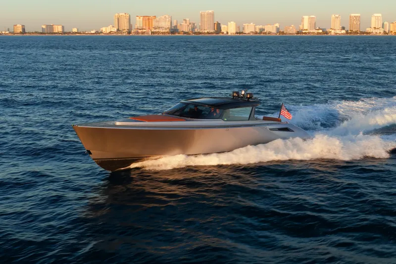 Slide: The Image of 2024 Wajer 55 HT yacht cruising on ocean with city skyline in background. - 52
