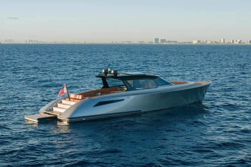 Slide: The Image of 2024 Wajer 55 HT yacht cruising on open sea with city skyline in background. - 53