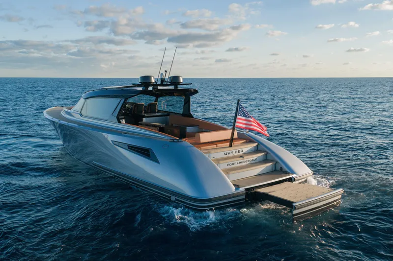 Slide: The Image of 2024 Wajer 55 HT yacht cruising on open sea with American flag. - 6