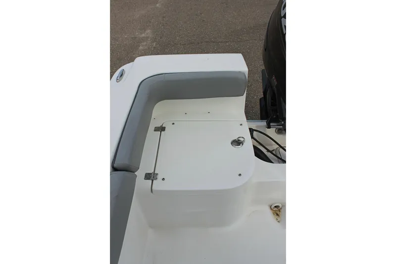 Slide: The Image of 2024 Clearwater 2200 CC boat seating and storage compartment detail. - 11