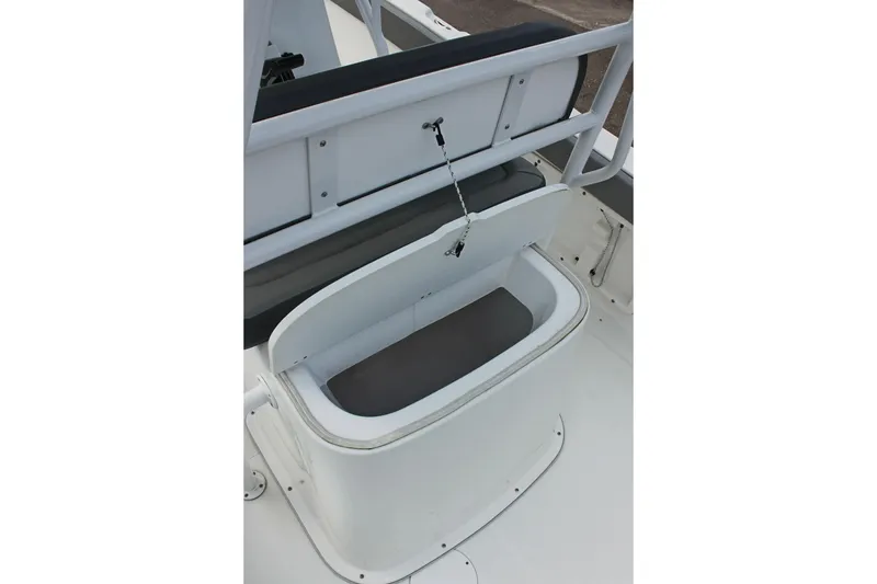 Slide: The Image of Open storage compartment on 2024 Clearwater 2200 CC boat deck. - 15