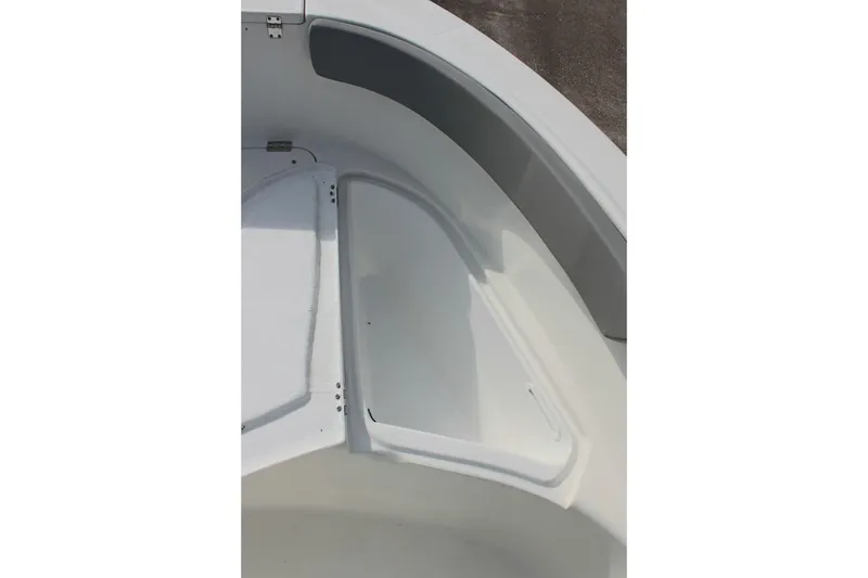 Slide: The Image of 2024 Clearwater 2200 CC boat interior detail with storage compartment. - 23
