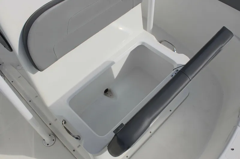 Slide: The Image of 2024 Clearwater 2200 CC boat seat with storage compartment open. - 26
