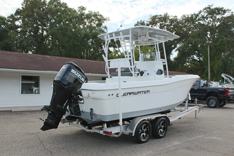 Slide: The Image of 2024 Clearwater 2200 CC boat on trailer with Suzuki outboard motor. - 6