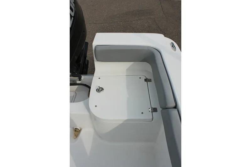 Slide: The Image of 2024 Clearwater 2200 CC boat seating and storage compartment detail. - 9