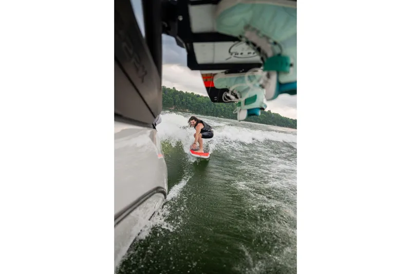 Slide: The Image of Person wakesurfing behind 2026 Yamaha Boats 222XD on a lake. - 17
