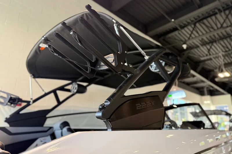 Slide: The Image of 2026 Yamaha Boats 222XD with sleek design and advanced features in showroom. - 26