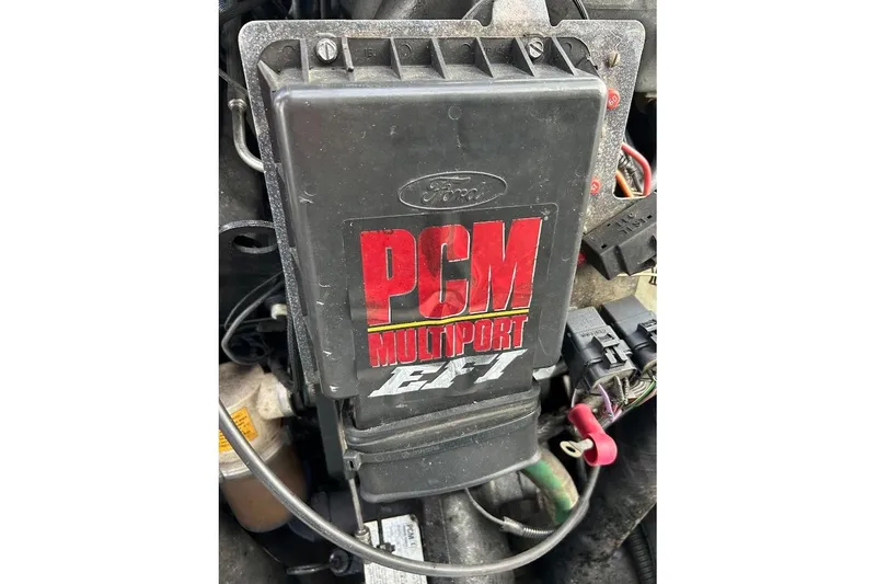 Slide: The Image of 2001 Correct Craft Air Nautique PCM Multiport EFI engine component close-up. - 13