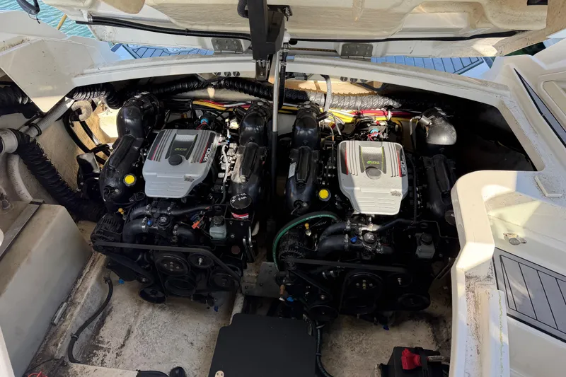 Slide: The Image of Engine compartment of a 2012 Monterey 328SS Super Sport boat, showcasing dual engines. - 17