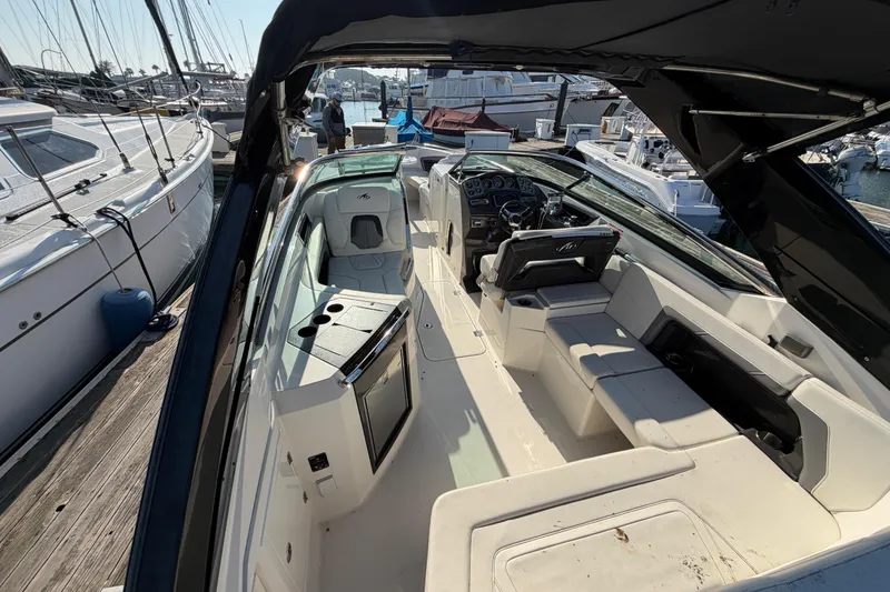 Slide: The Image of Interior view of a 2012 Monterey 328SS Super Sport boat at the marina. - 25