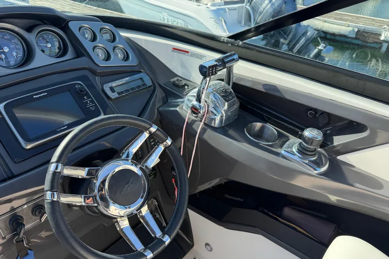 Slide: The Image of Steering wheel and controls of a 2012 Monterey 328SS Super Sport boat. - 9