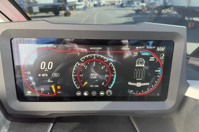 Slide: The Image of Dashboard of 2021 Malibu Wakesetter 23 MXZ showing speed, RPM, and ballast controls. - 16